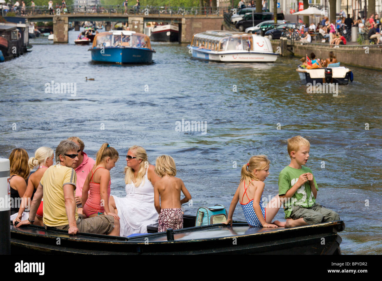 Family in canal boat on Amsterdam canals