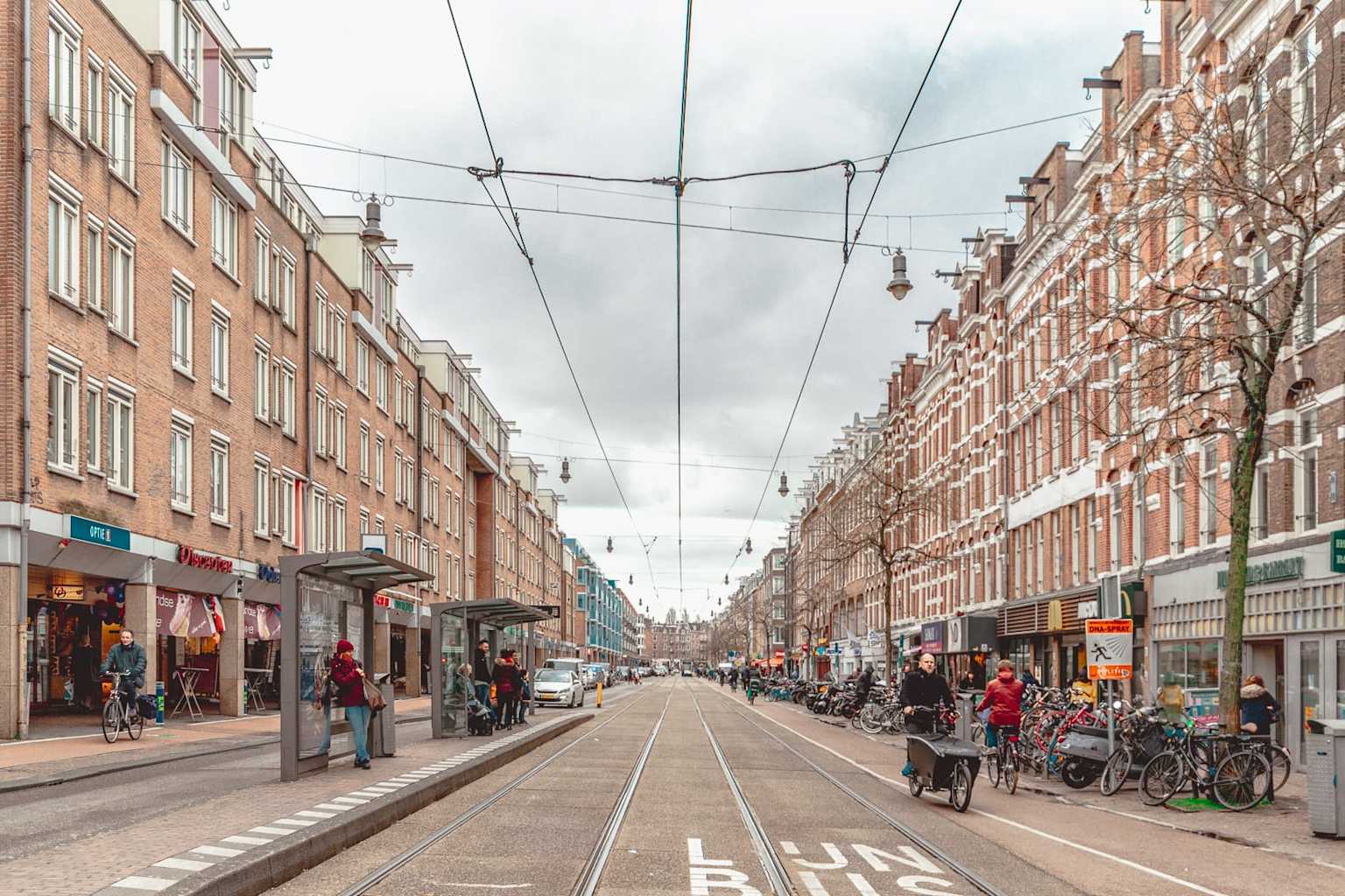 Amsterdam Oud-West street with trams and brick houses
